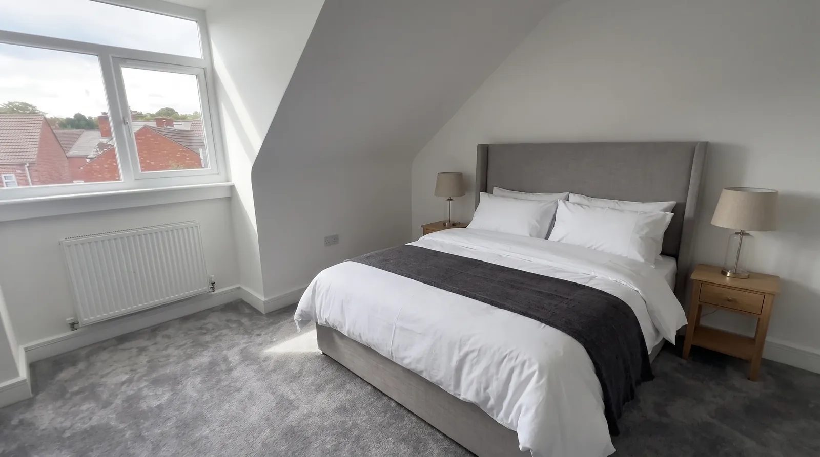 Stoke House — the top-floor bedroom with a king-size bed (illustrative furnishing)