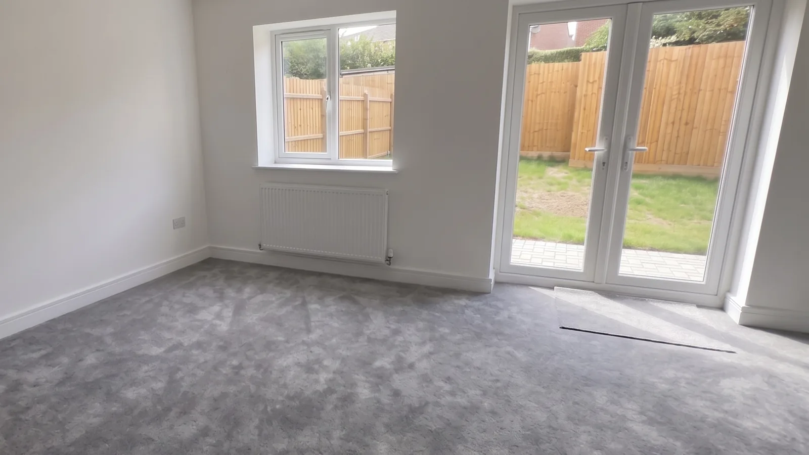 Stoke House — Living room with French doors to the garden