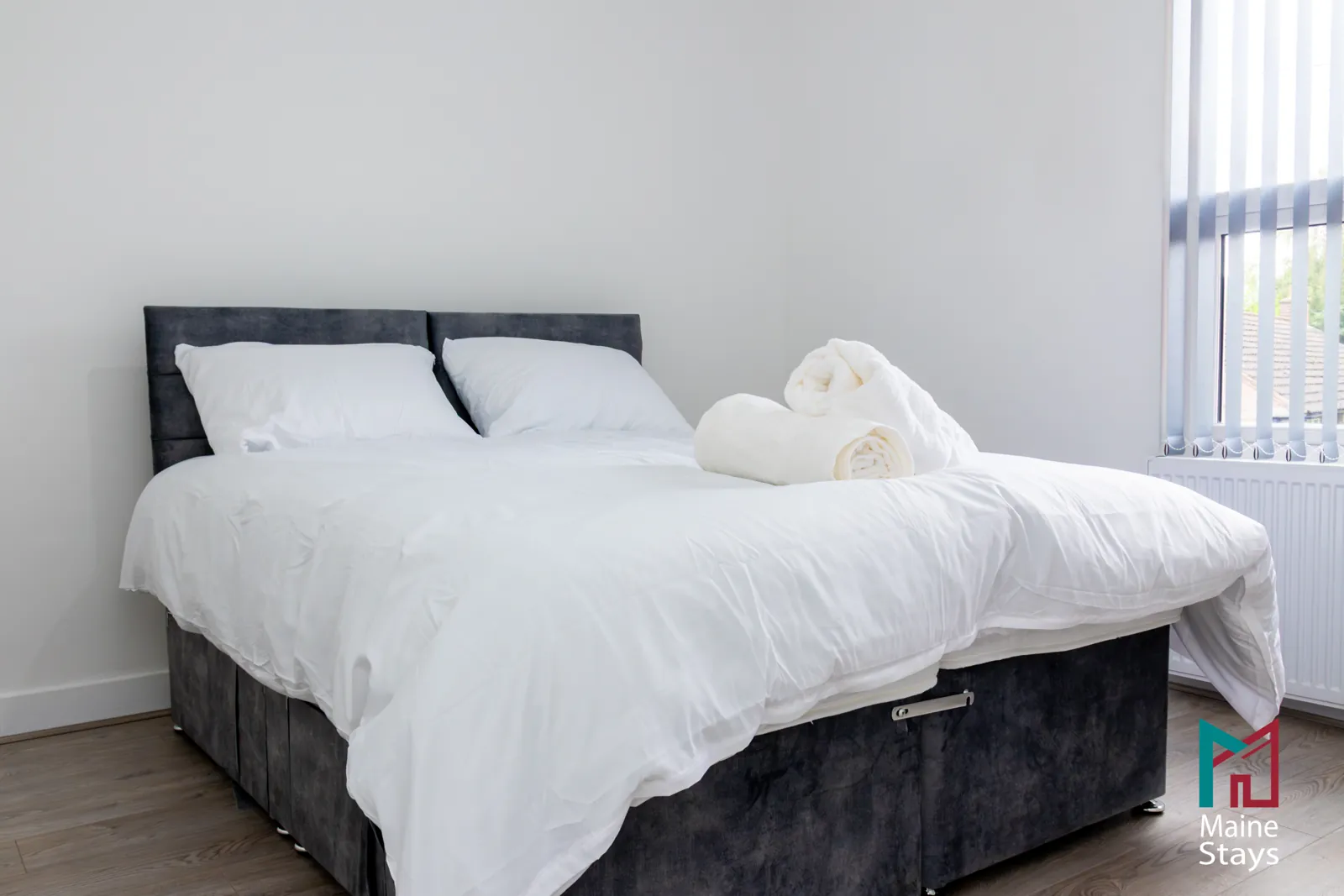 The Dudley Lounge — Double bed with fresh white bedding and towels