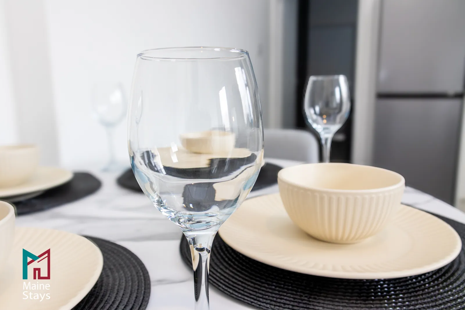 The Dudley Lounge — Table set with plates, bowls and wine glasses