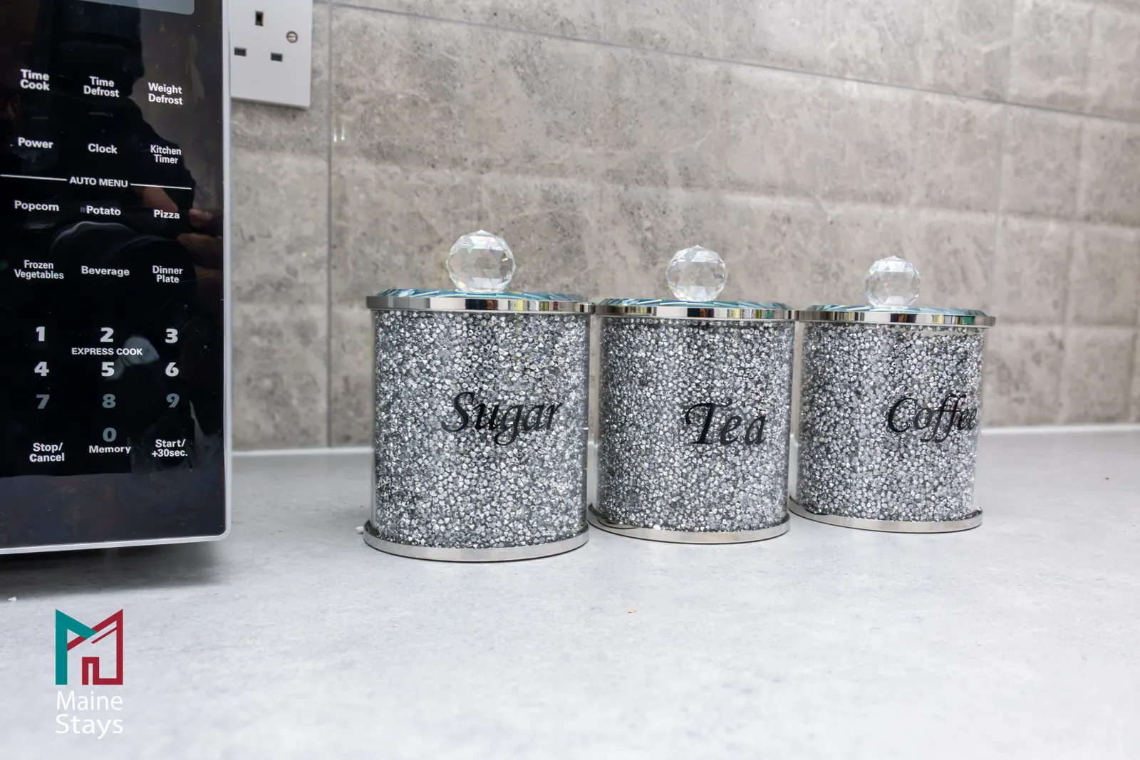 The Dudley Lounge — Sugar, tea and coffee canisters in the kitchen