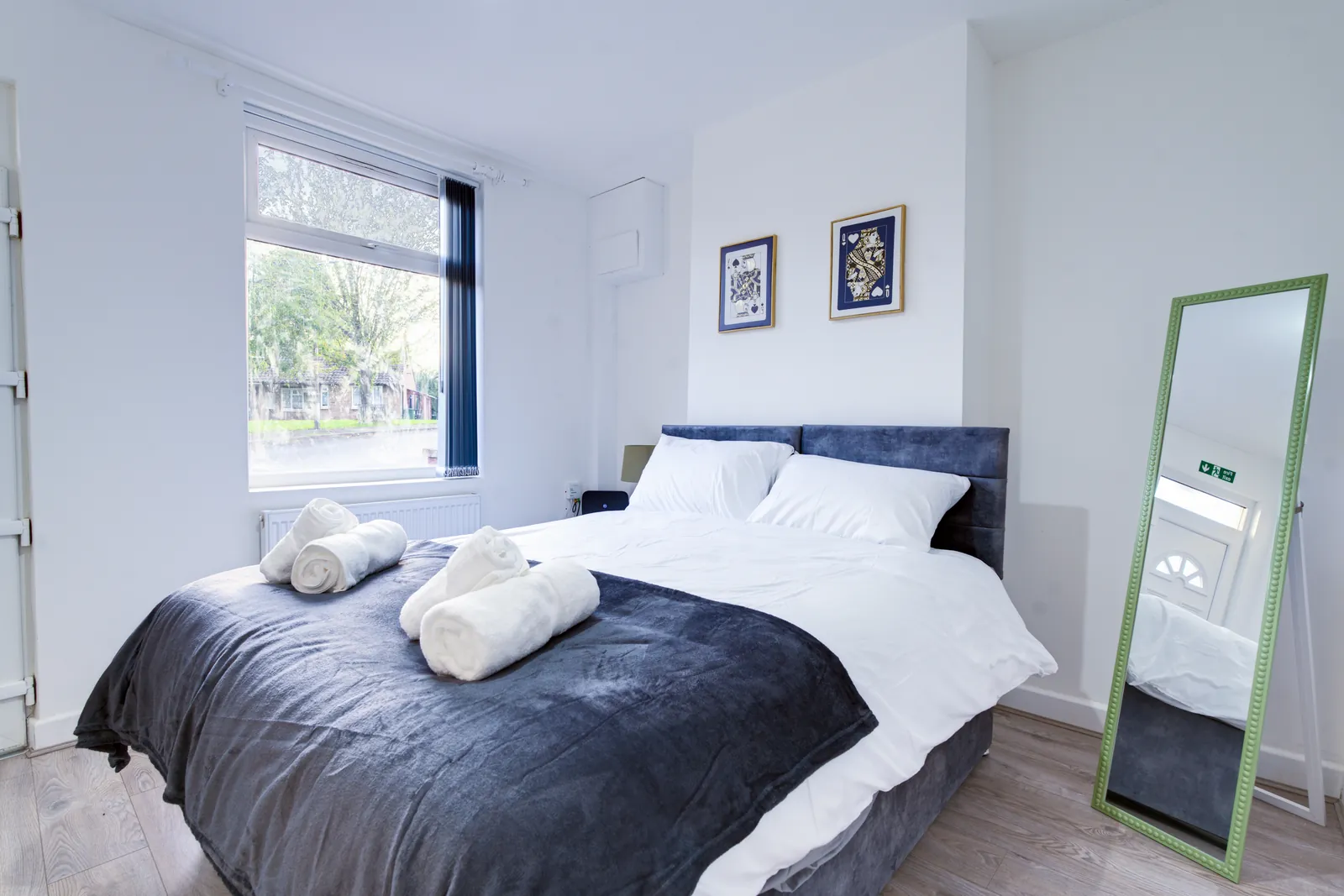The Merry Hill Lounge: ground-floor double bedroom with a full-length mirror