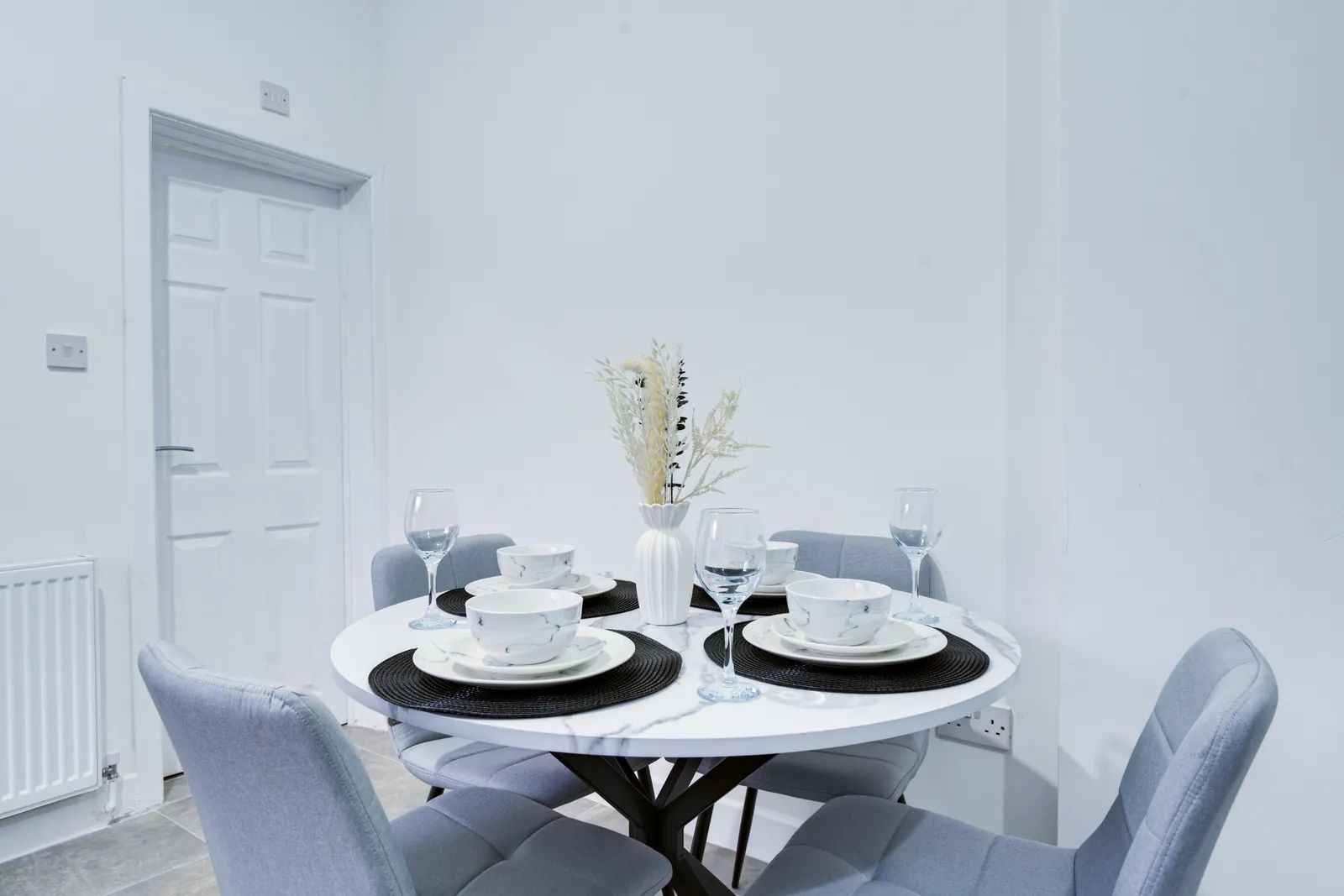The Merry Hill Lounge: round dining table for four